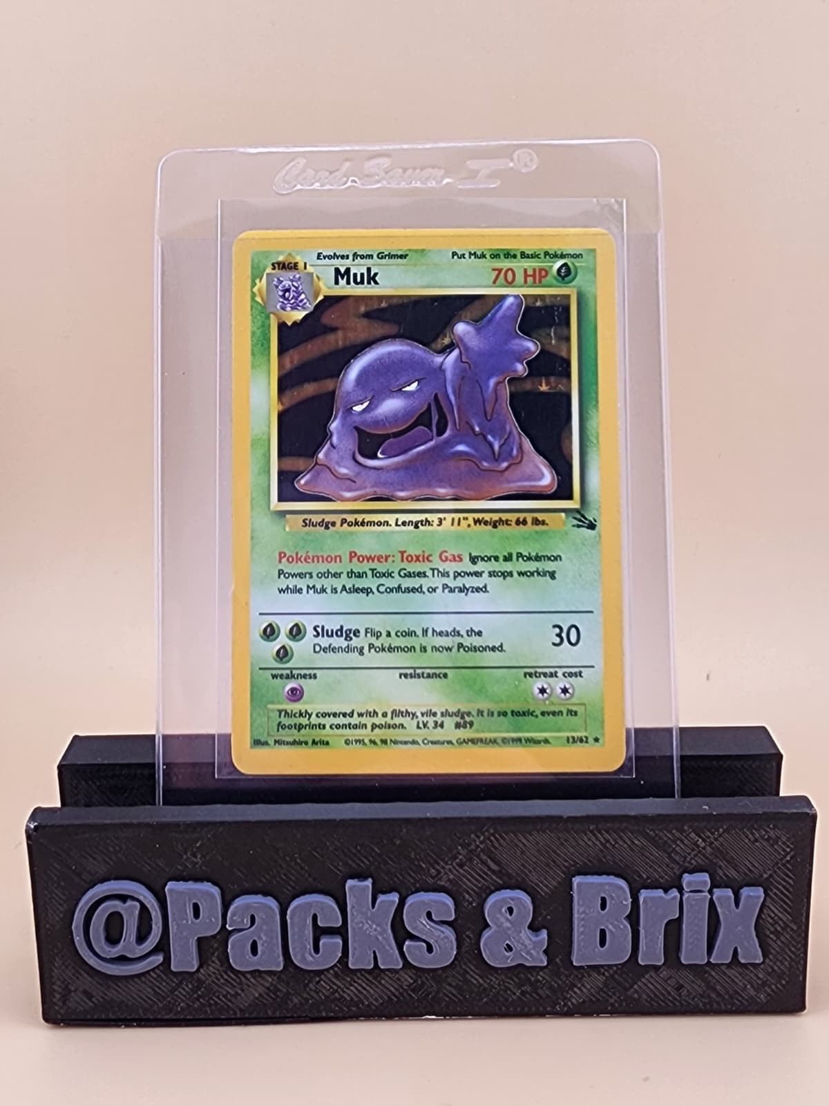 Muk 13/62 Fossil Holo Lightly Played (LP)