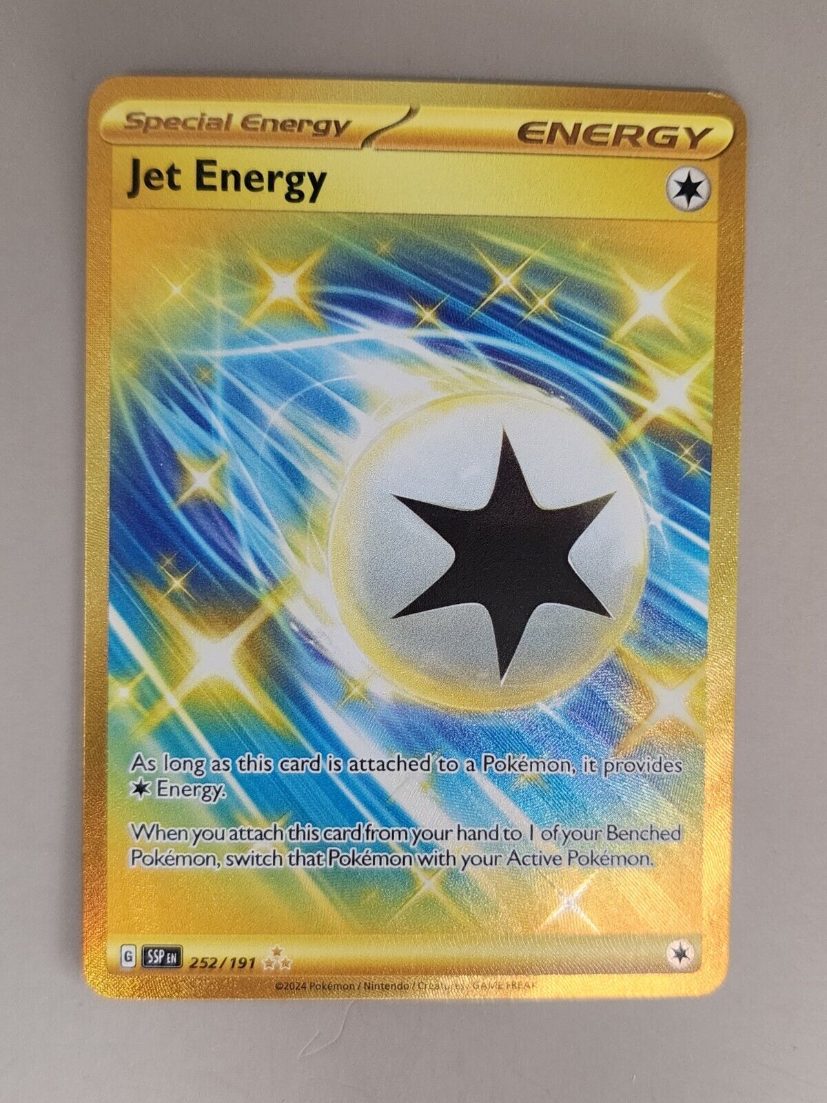 Jet Energy 252/191 Surging Sparks - Gold Pokémon Card - NM