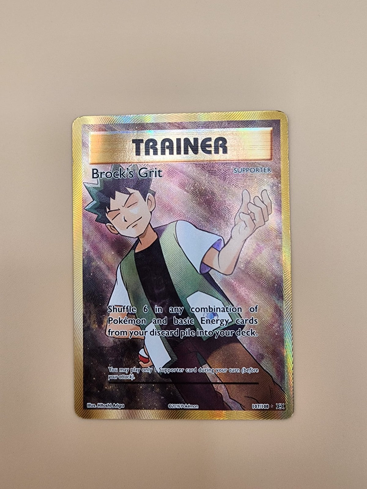 Brock's Grit (Full Art) 107/108 Evolutions Holo Near Mint (NM)