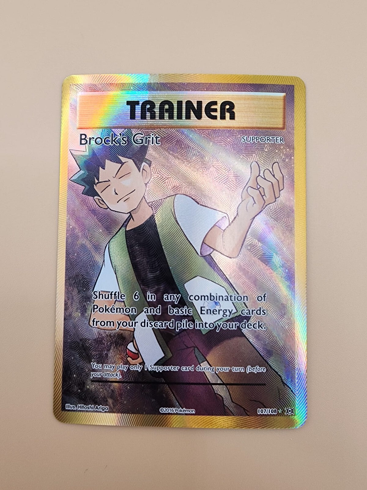 Brock's Grit (Full Art) 107/108 Evolutions Holo Near Mint (NM)