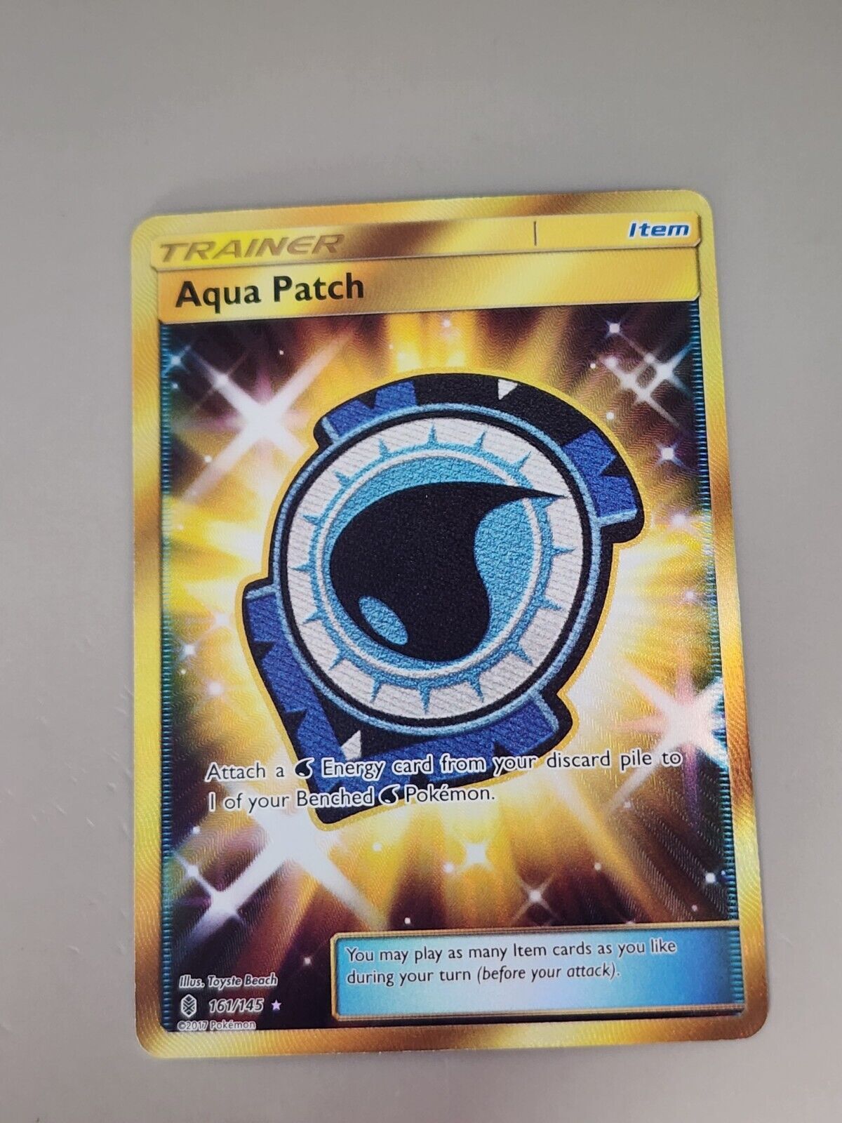 Aqua Patch (Secret) 161/145 Sm-Guardians Rising Holo