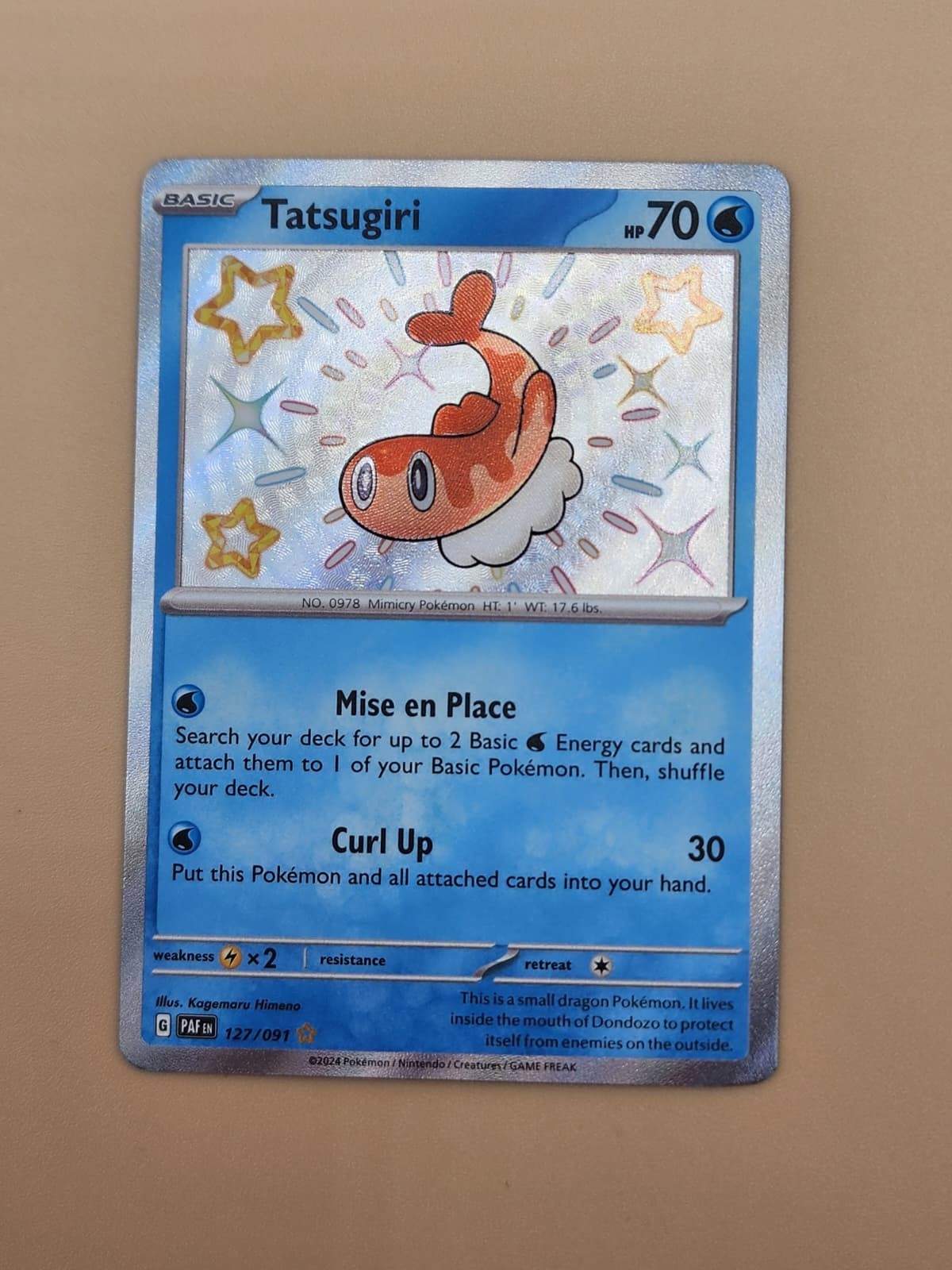 Tatsugiri 127/091 SV: Paldean Fates Holo Near Mint (NM)